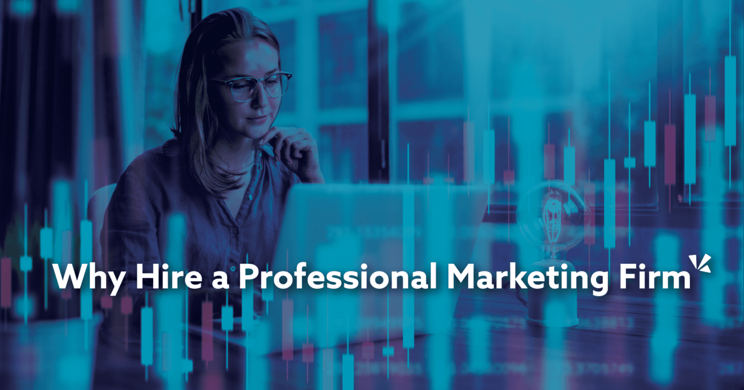 Woman using a computer in an office setting "Why hire a professtional marketing firm"