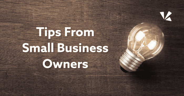 Tips From Small Business Owners with a lightbulb laying on a wooded background