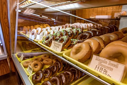 Raphael's Bakery donuts in a glass case