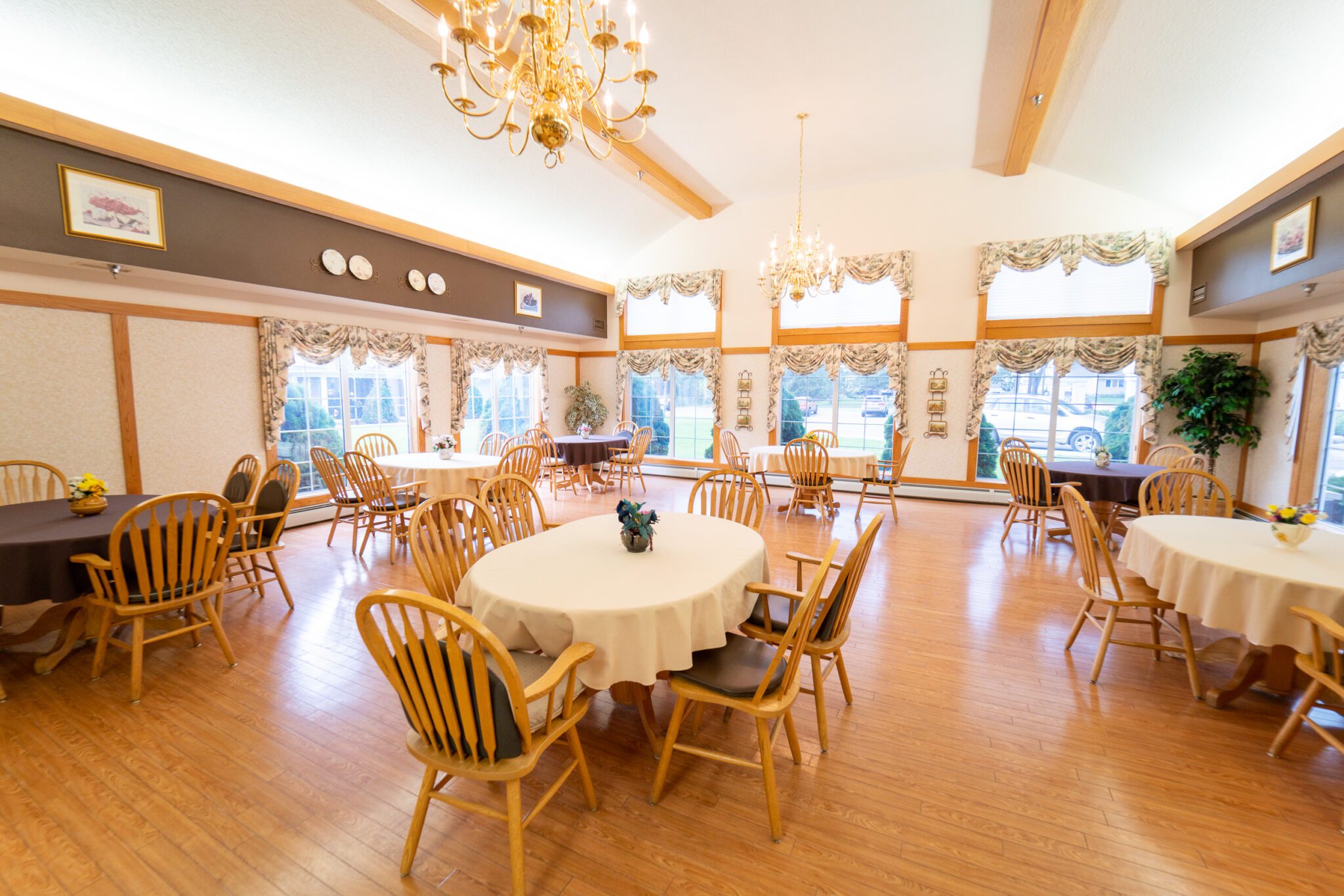 Eldercare of Bemidji dining hall with chairs and tables with tablecloths