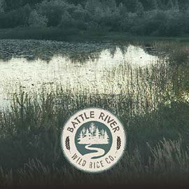 Battle River Wild Rice logo on a background of a lake with wild rice growing