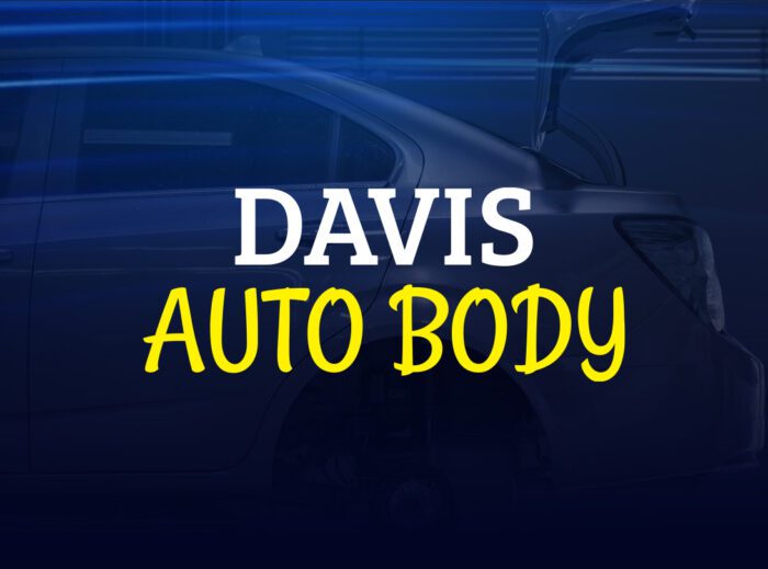 Davis Auto Body logo over a car repair background, highlighting auto body repair services in Turtle Lake, designed by Pinnacle Marketing Group.