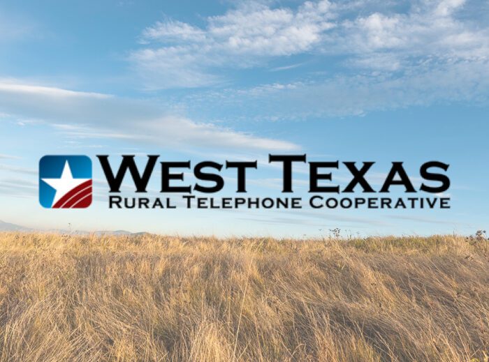 Logo of West Texas Rural Telephone Cooperative displayed over a background of an open West Texas prairie under a blue sky with scattered clouds.